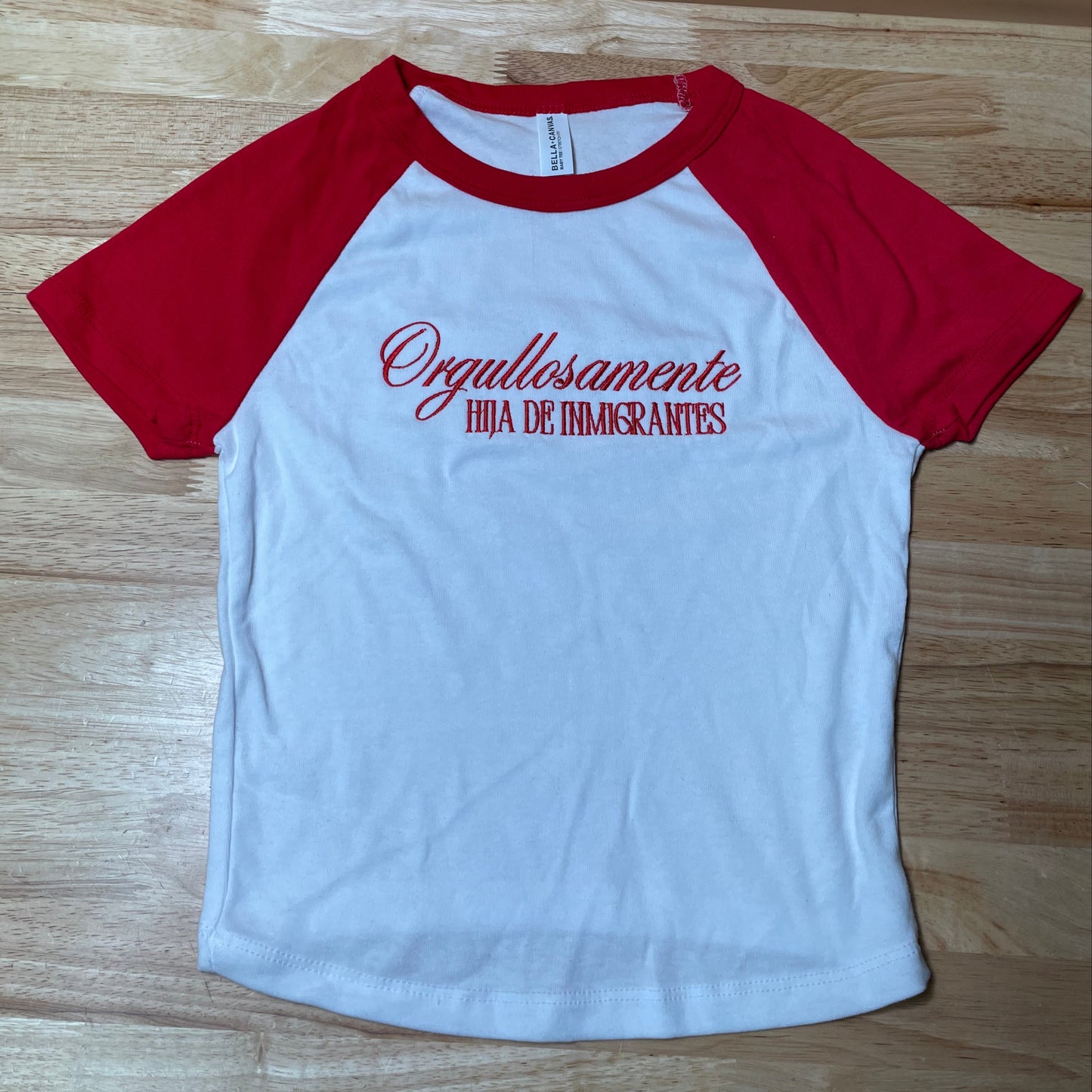 Ogullosamente Hija De Inmigrantes Baby Tee
