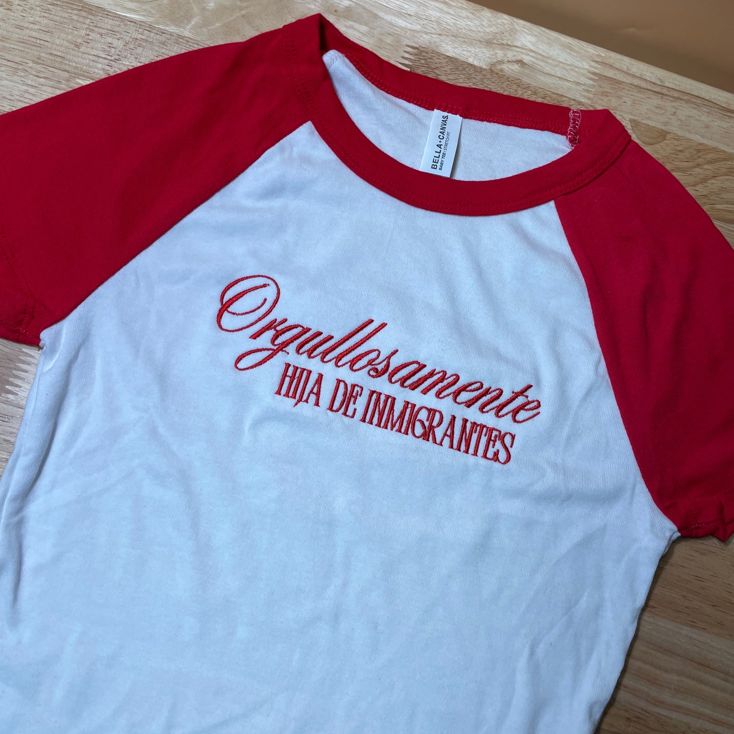 Ogullosamente Hija De Inmigrantes Baby Tee
