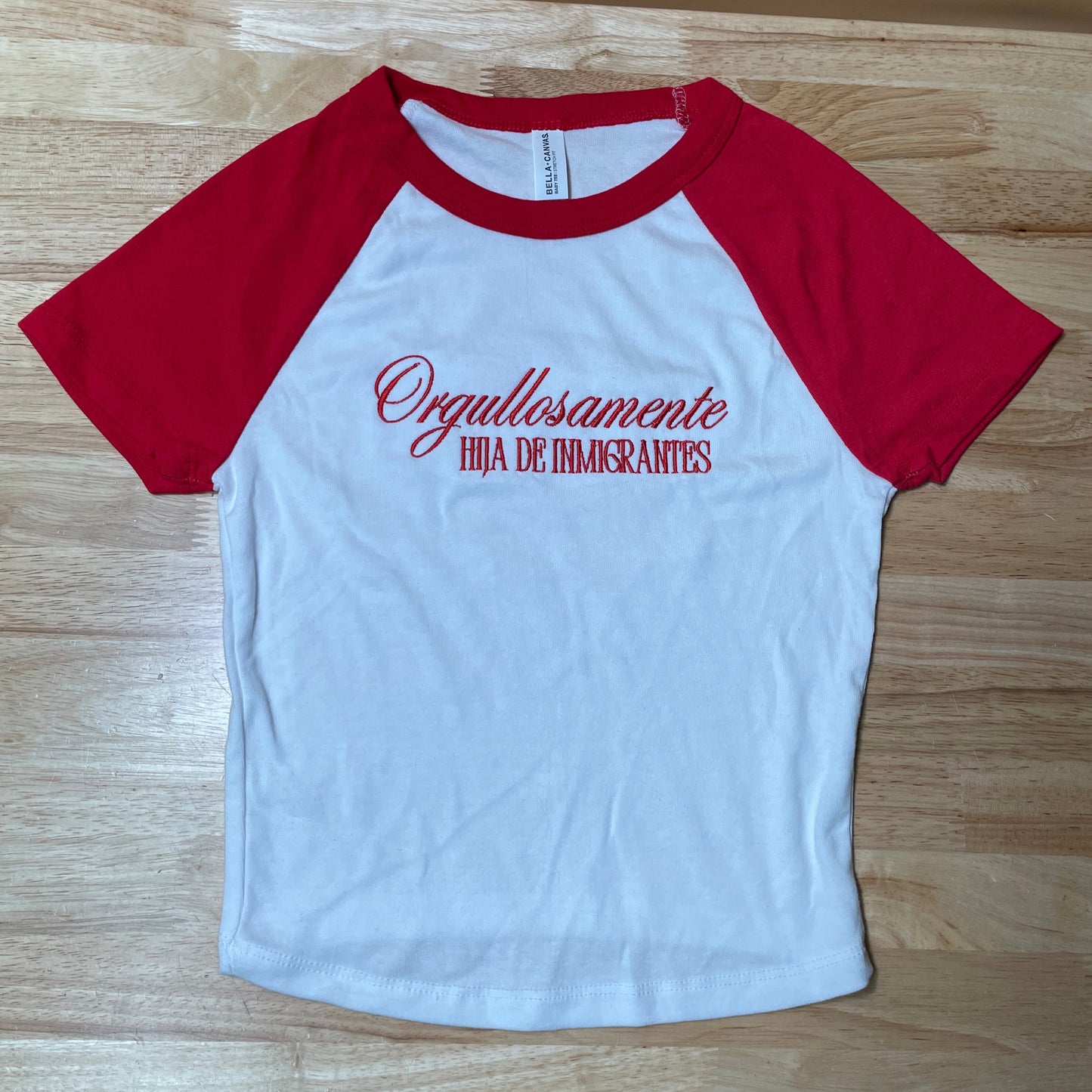 Ogullosamente Hija De Inmigrantes Baby Tee