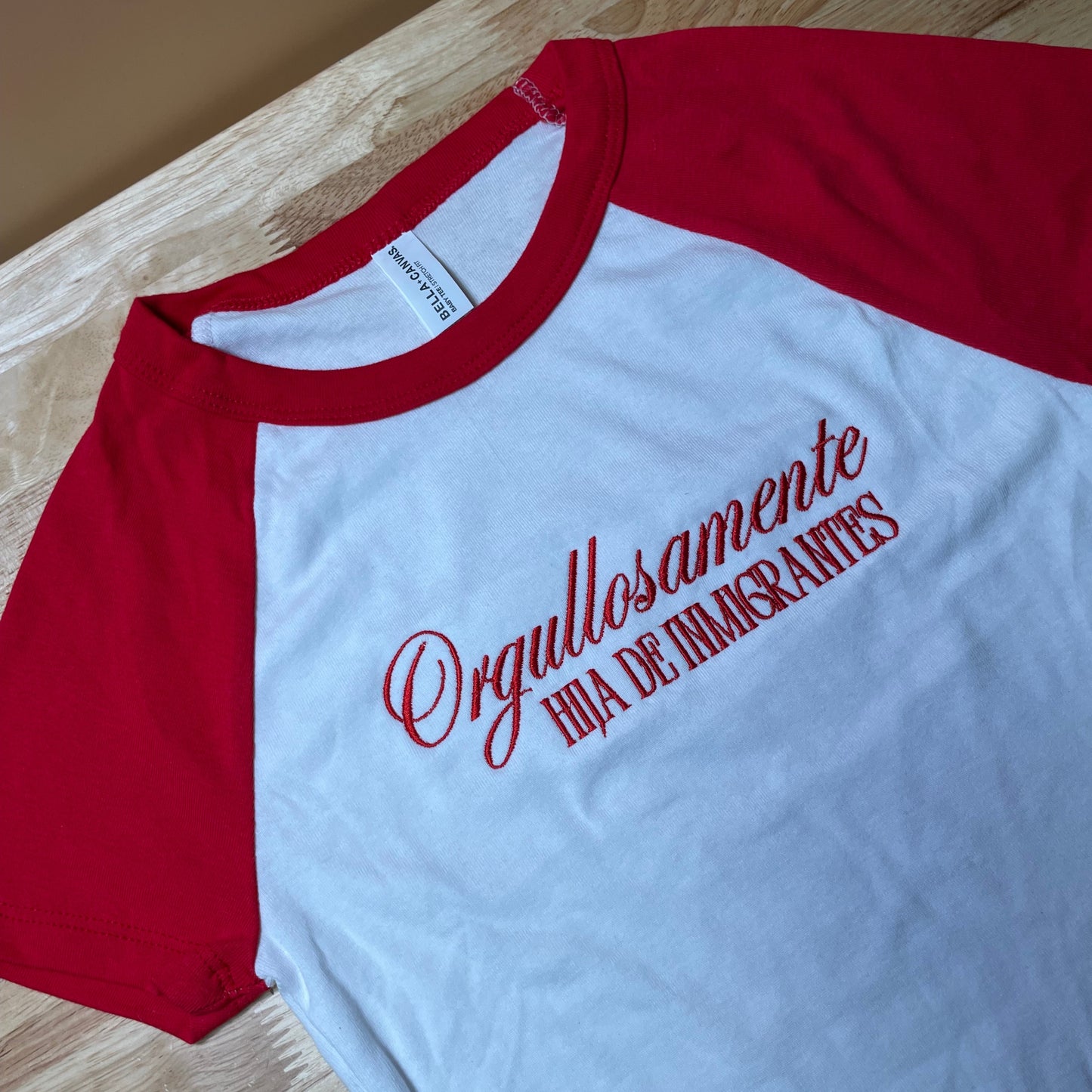 Ogullosamente Hija De Inmigrantes Baby Tee