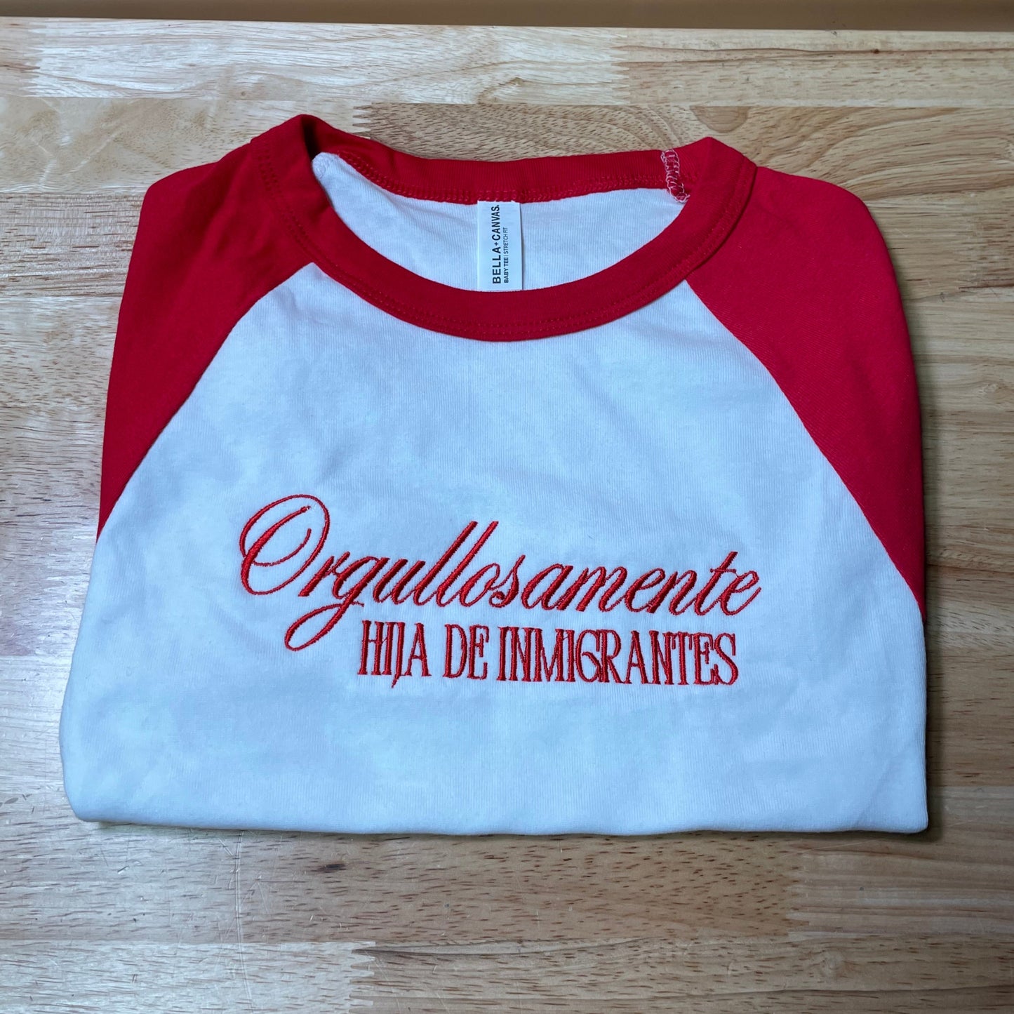 Ogullosamente Hija De Inmigrantes Baby Tee